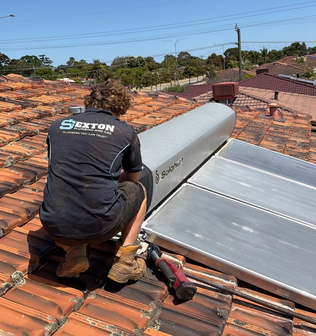 Sexton Plumbing van parked outside a Mandurah home with tools and pipe at the kerb